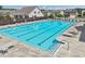 Exterior view of a large rectangular pool with lounge chairs and landscaping, an attractive community amenity at 3382 Long Creek Dr, Buford, GA 30519