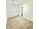 Finished basement with vinyl floors, neutral paint, recessed lighting and access to other rooms at 8399 Lake Dr, Snellville, GA 30039