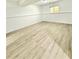 Finished basement space with vinyl floors, painted walls and a window for natural light at 8399 Lake Dr, Snellville, GA 30039