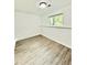 Finished basement featuring vinyl flooring, a window, and painted trim at 8399 Lake Dr, Snellville, GA 30039