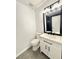 Modern bathroom with a new white vanity and black hardware, plus a tiled shower at 8399 Lake Dr, Snellville, GA 30039