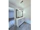 Bright bathroom featuring double sinks and modern vanity at 8399 Lake Dr, Snellville, GA 30039