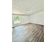 Spacious bedroom featuring hardwood floors, a window, and fresh paint at 8399 Lake Dr, Snellville, GA 30039