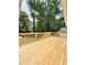 New wood deck overlooking large wooded lot at 8399 Lake Dr, Snellville, GA 30039