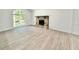A bright living room is enhanced by a decorative fireplace and large windows at 8399 Lake Dr, Snellville, GA 30039