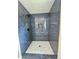 Stunning shower with tile and mosaic floor at 8399 Lake Dr, Snellville, GA 30039