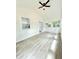 Open-concept sunroom with plank walls, bright windows and vinyl plank flooring at 8399 Lake Dr, Snellville, GA 30039