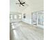 Bright sunroom featuring plank walls, bright windows, and access to the rear deck at 8399 Lake Dr, Snellville, GA 30039