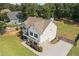 Aerial view showing the backyard, driveway, and well-maintained landscaping surrounding the house at 13 Four Feathers Ln, Rydal, GA 30171