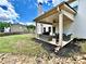 Backyard patio featuring comfortable seating, outdoor grill, and manicured landscaping at 13 Four Feathers Ln, Rydal, GA 30171