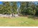 The large backyard features a play structure and plenty of green space, perfect for outdoor activities at 13 Four Feathers Ln, Rydal, GA 30171