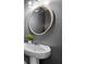 Stylish pedestal sink with a round mirror set against a dark gray wall in the bathroom at 13 Four Feathers Ln, Rydal, GA 30171