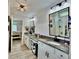 Stylish bathroom featuring double sinks, modern fixtures, and elegant tile flooring at 13 Four Feathers Ln, Rydal, GA 30171