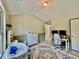 A bright bedroom with a sloped ceiling, a Persian-style rug, and a built-in desk area at 13 Four Feathers Ln, Rydal, GA 30171