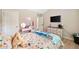 bedroom features a playful theme, a dressing table, a cozy bed, and a TV for entertainment at 13 Four Feathers Ln, Rydal, GA 30171
