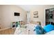 Bedroom showcasing a large bed, wooden floors, and closet, offering ample storage and space at 13 Four Feathers Ln, Rydal, GA 30171