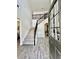 Inviting foyer showcasing the staircase and an open view to the dining room, enhancing the home's appeal at 13 Four Feathers Ln, Rydal, GA 30171