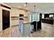Modern kitchen with central island, granite countertops, stainless appliances, and ample cabinet space at 13 Four Feathers Ln, Rydal, GA 30171
