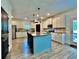 Modern kitchen with central island, granite countertops, stainless appliances, and ample cabinet space at 13 Four Feathers Ln, Rydal, GA 30171