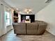 Bright living room with a gray couch, fireplace, and stylish decor at 13 Four Feathers Ln, Rydal, GA 30171