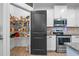 Walk-in pantry adjacent to the kitchen, offering ample storage space with wire shelving and easy access to appliances at 13 Four Feathers Ln, Rydal, GA 30171