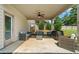 Covered patio featuring comfortable seating and a ceiling fan, ideal for relaxing outdoors at 13 Four Feathers Ln, Rydal, GA 30171