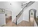 Staircase leading to other rooms in the house, with access to the dining room and kitchen on the main floor at 13 Four Feathers Ln, Rydal, GA 30171