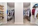 Dual walk-in closets with built-in shelving and hanging rods for organized storage of clothing and accessories at 13 Four Feathers Ln, Rydal, GA 30171