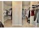 Spacious walk-in closet with ample storage and hanging space for clothes at 13 Four Feathers Ln, Rydal, GA 30171