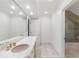 Clean and bright bathroom with marble countertops, tile floors, and a glass-enclosed shower at 3212 Arden Nw Rd, Atlanta, GA 30305