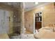 Luxurious bathroom with marble countertops, a glass-enclosed shower, and a walk-in closet, providing ample storage at 3212 Arden Nw Rd, Atlanta, GA 30305