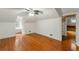 Bright bedroom with hardwood floors, ceiling fan, and ample natural light from the window creates an airy atmosphere at 3212 Arden Nw Rd, Atlanta, GA 30305