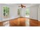 Airy bedroom with hardwood floors and large windows providing ample natural light and views of the outdoors at 3212 Arden Nw Rd, Atlanta, GA 30305