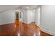 Spacious room with hardwood floors and neutral paint with multiple doors and storage creates an open and adaptable floor plan at 3212 Arden Nw Rd, Atlanta, GA 30305