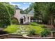 Beautifully landscaped backyard with a stone walkway leading to the home's pavilion at 3212 Arden Nw Rd, Atlanta, GA 30305