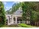 Charming exterior view of the home's pavilion with a dome roof, white columns, and lush greenery at 3212 Arden Nw Rd, Atlanta, GA 30305