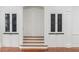 Elegant foyer with built-in cabinets and classic white doors, showcasing refined architectural details and craftsmanship at 3212 Arden Nw Rd, Atlanta, GA 30305
