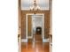 Foyer of a luxurious home, with hardwood floors and a view to a fireplace at 3212 Arden Nw Rd, Atlanta, GA 30305