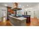 Gourmet kitchen with island cooktop, stainless steel appliances and views of the backyard at 3212 Arden Nw Rd, Atlanta, GA 30305