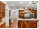 Gourmet kitchen with stainless steel appliances, wood cabinets and a convenient island cooktop at 3212 Arden Nw Rd, Atlanta, GA 30305
