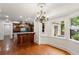 Eat-in kitchen featuring a chandelier, stainless steel appliances, wood cabinets and a breakfast nook at 3212 Arden Nw Rd, Atlanta, GA 30305