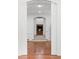 Inviting living room with a fireplace view, arched doorways, and hardwood flooring, creating a cozy and stylish space at 3212 Arden Nw Rd, Atlanta, GA 30305
