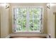 Charming windows with decorative sconces overlook lush greenery, bringing natural beauty inside this inviting space at 3212 Arden Nw Rd, Atlanta, GA 30305
