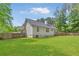 Spacious backyard features lush green lawn and privacy fence, perfect for outdoor enjoyment at 37 Winesap Ct, Temple, GA 30179
