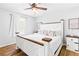 Comfortable bedroom featuring a stylish bed with decorative pillows, wooden accents, and cozy decor at 37 Winesap Ct, Temple, GA 30179