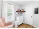 Comfortable Bedroom with a cozy pink rocking chair, a changing table, and soft decor at 37 Winesap Ct, Temple, GA 30179