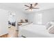 Cozy bedroom features a ceiling fan, wooden floors and neutral decor for a relaxing retreat at 37 Winesap Ct, Temple, GA 30179