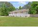 Attractive home with a welcoming front porch and lush green lawn at 37 Winesap Ct, Temple, GA 30179