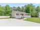 Charming home with covered porch, landscaped front, and driveway at 37 Winesap Ct, Temple, GA 30179