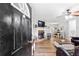 Welcoming living room featuring a fireplace, hardwood floors, and ample seating at 37 Winesap Ct, Temple, GA 30179